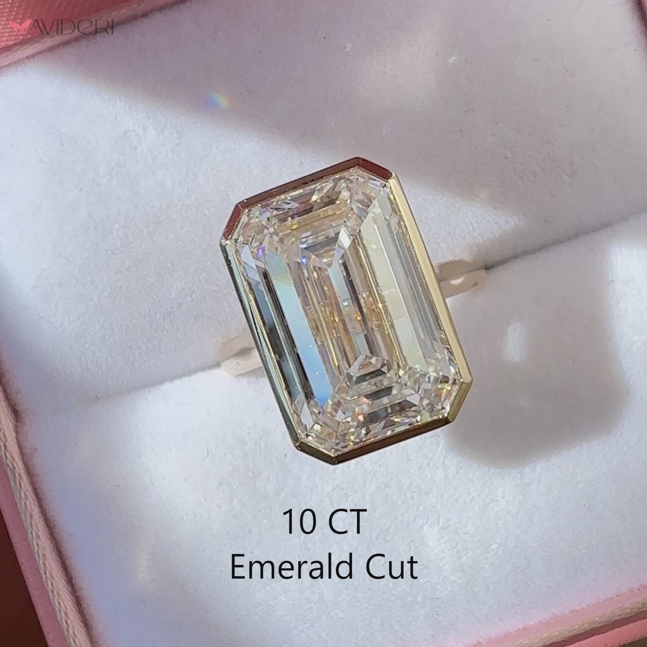 Bezel Set Emerald Cut Diamond Solitaire Ring.