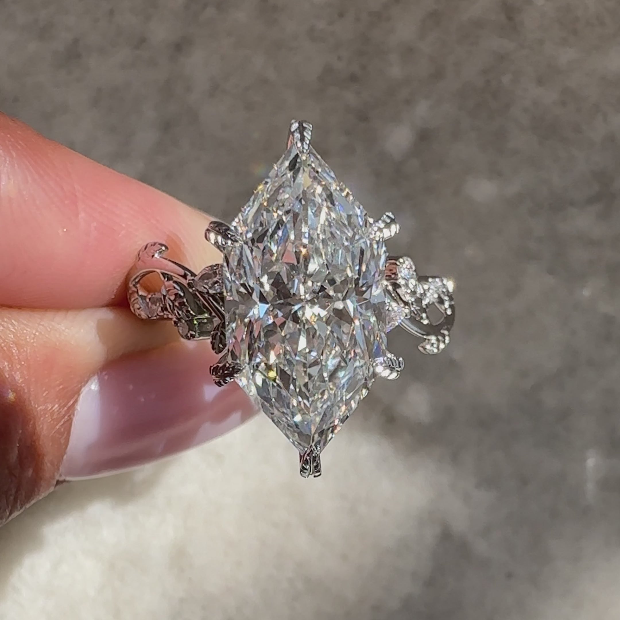 Nature style marquise ring with side stones.

