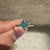 Cyan blue moissanite ring with solitaire style.
