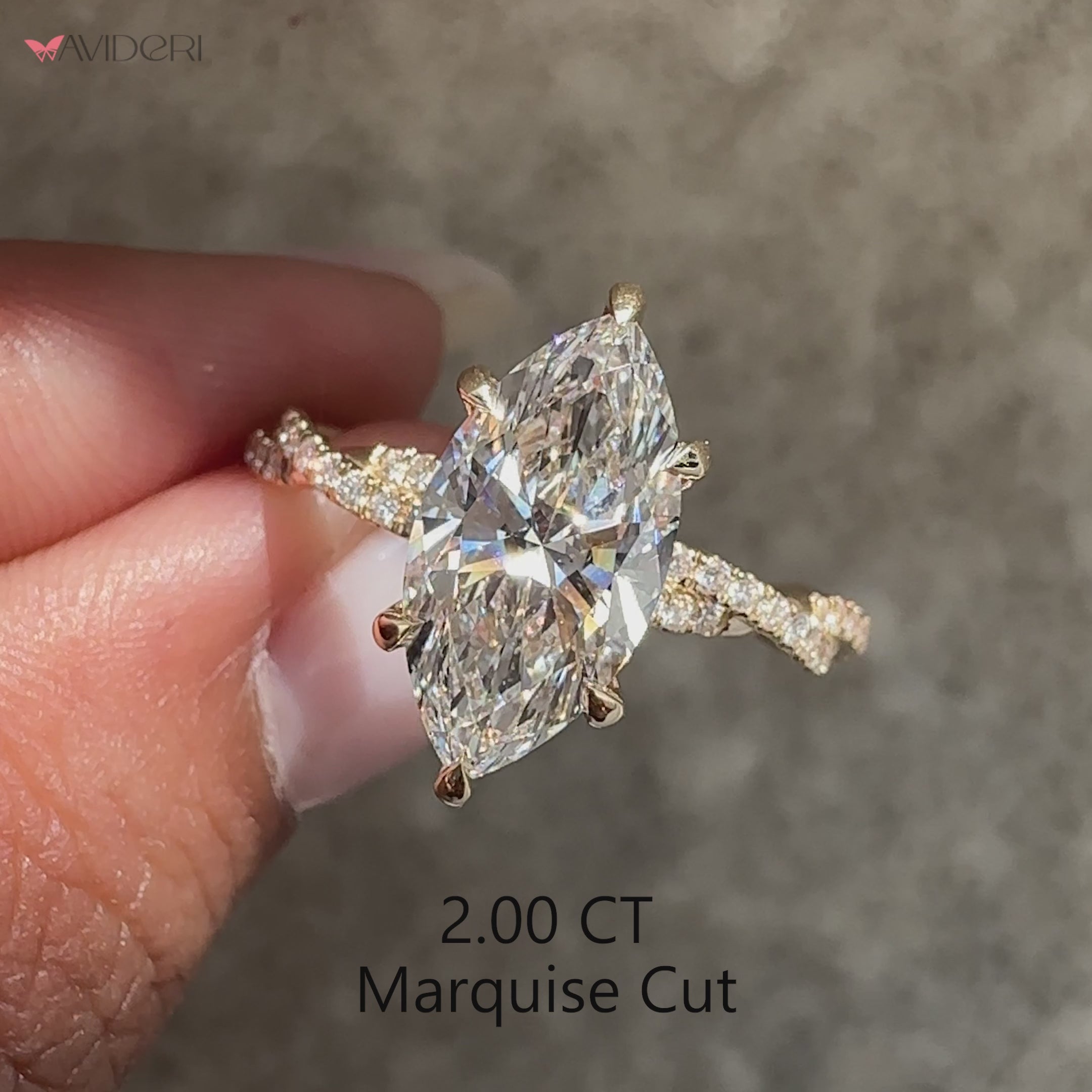 Marquise cut diamond ring with modern twisted band.
