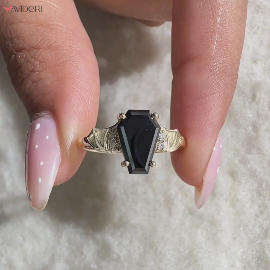 Moissanite engagement ring in black coffin engagement ring.