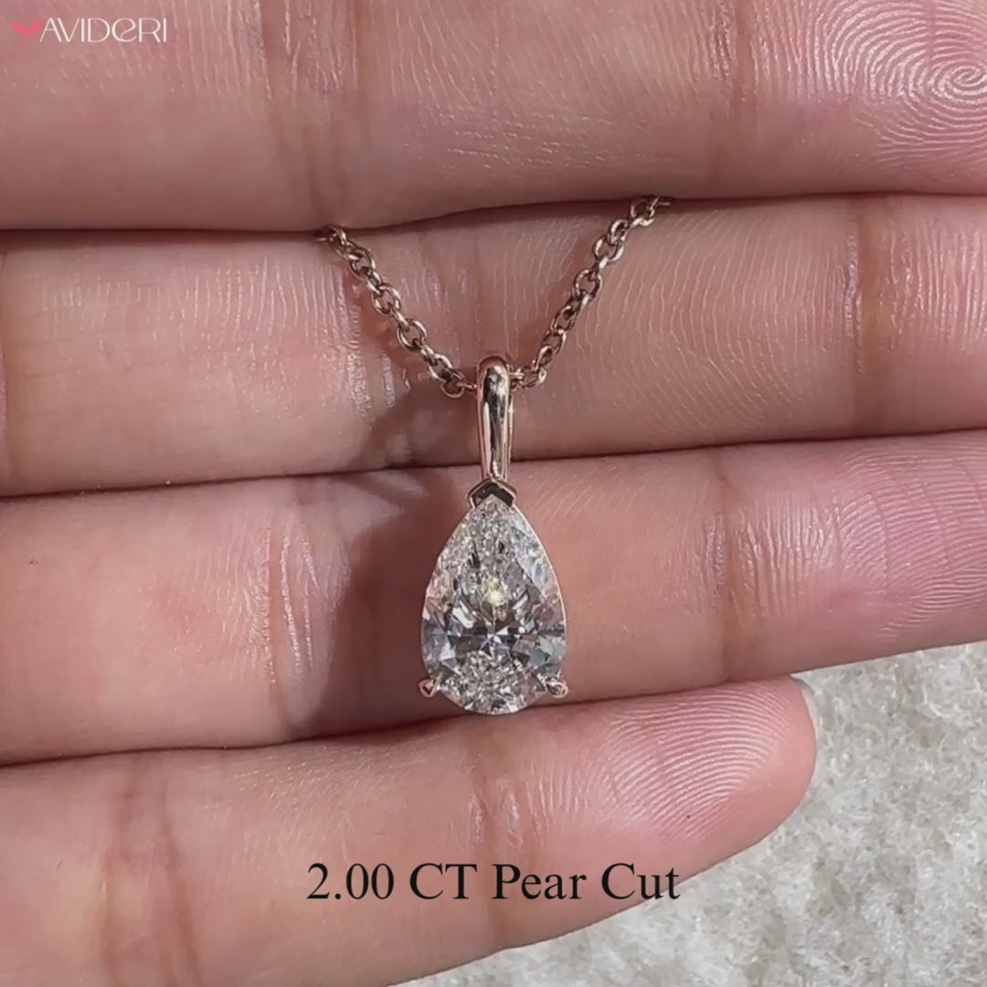 Pear shaped diamond pendant in solitaire pendant style.