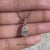 Pear shaped diamond pendant in solitaire pendant style.