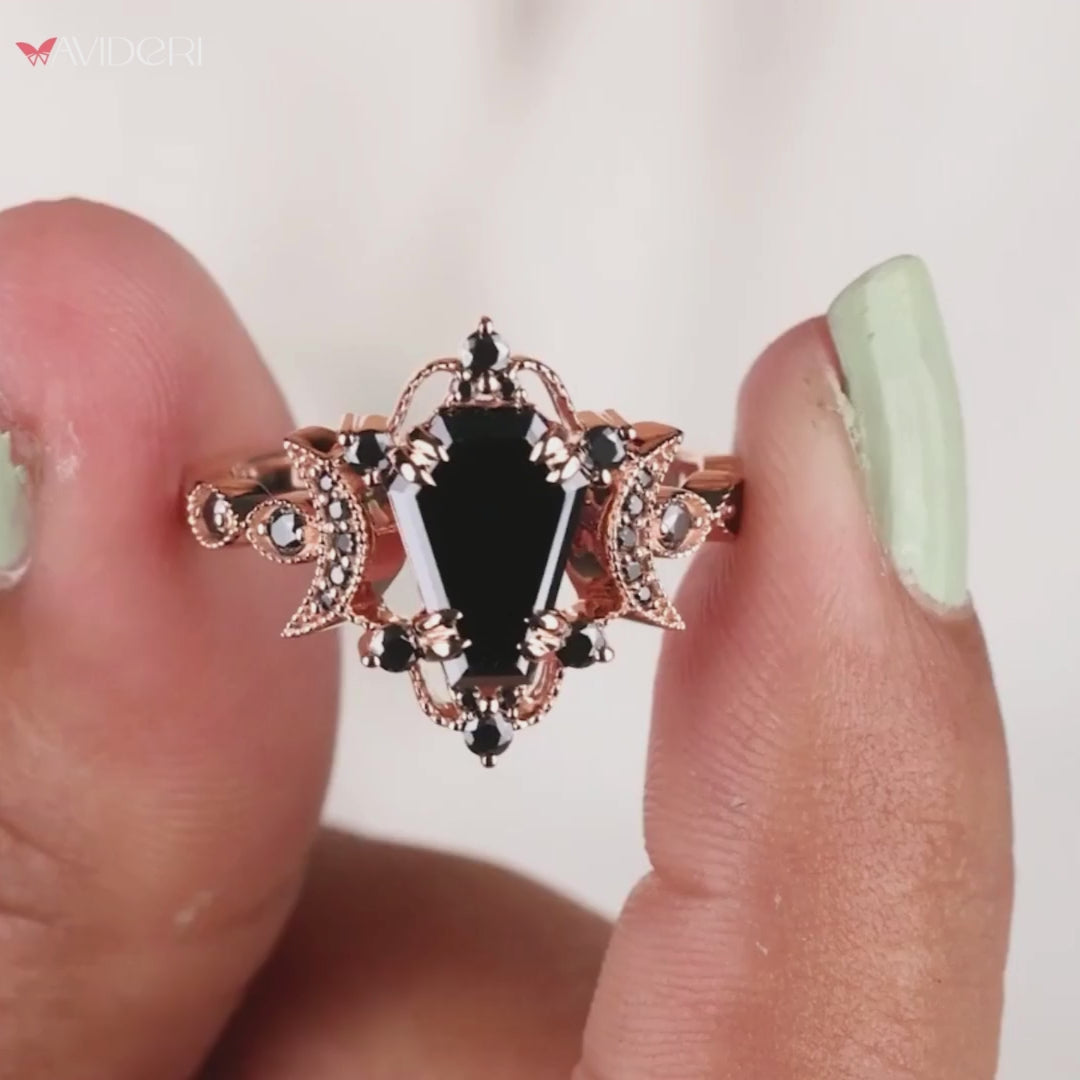 Vintage engagement ring featuring a coffin design and intricate details.
