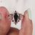 Vintage engagement ring featuring a coffin design and intricate details.
