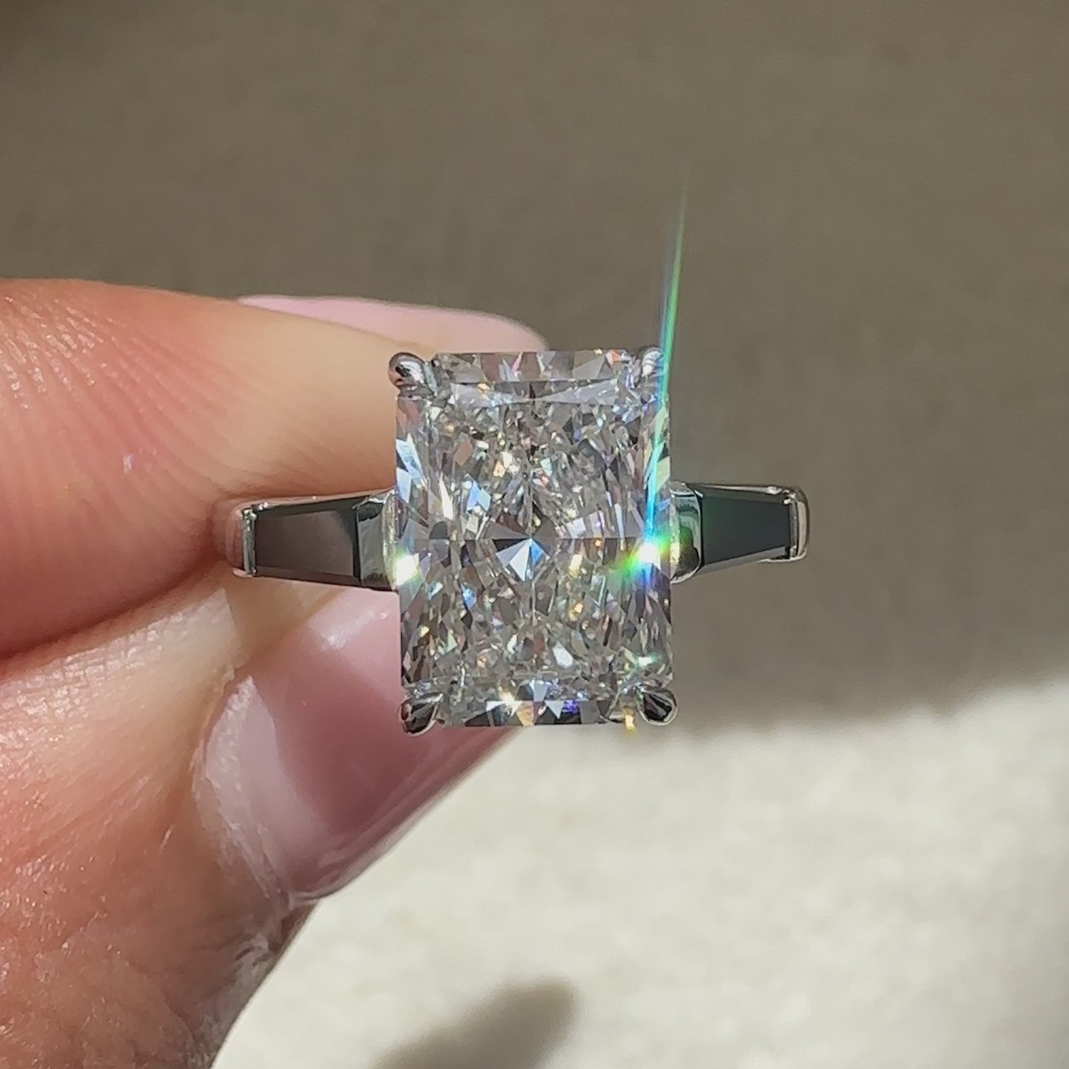 Handmade three stone radiant diamond ring.
