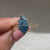 Dutch marquise blue diamond engagement ring with floral details
