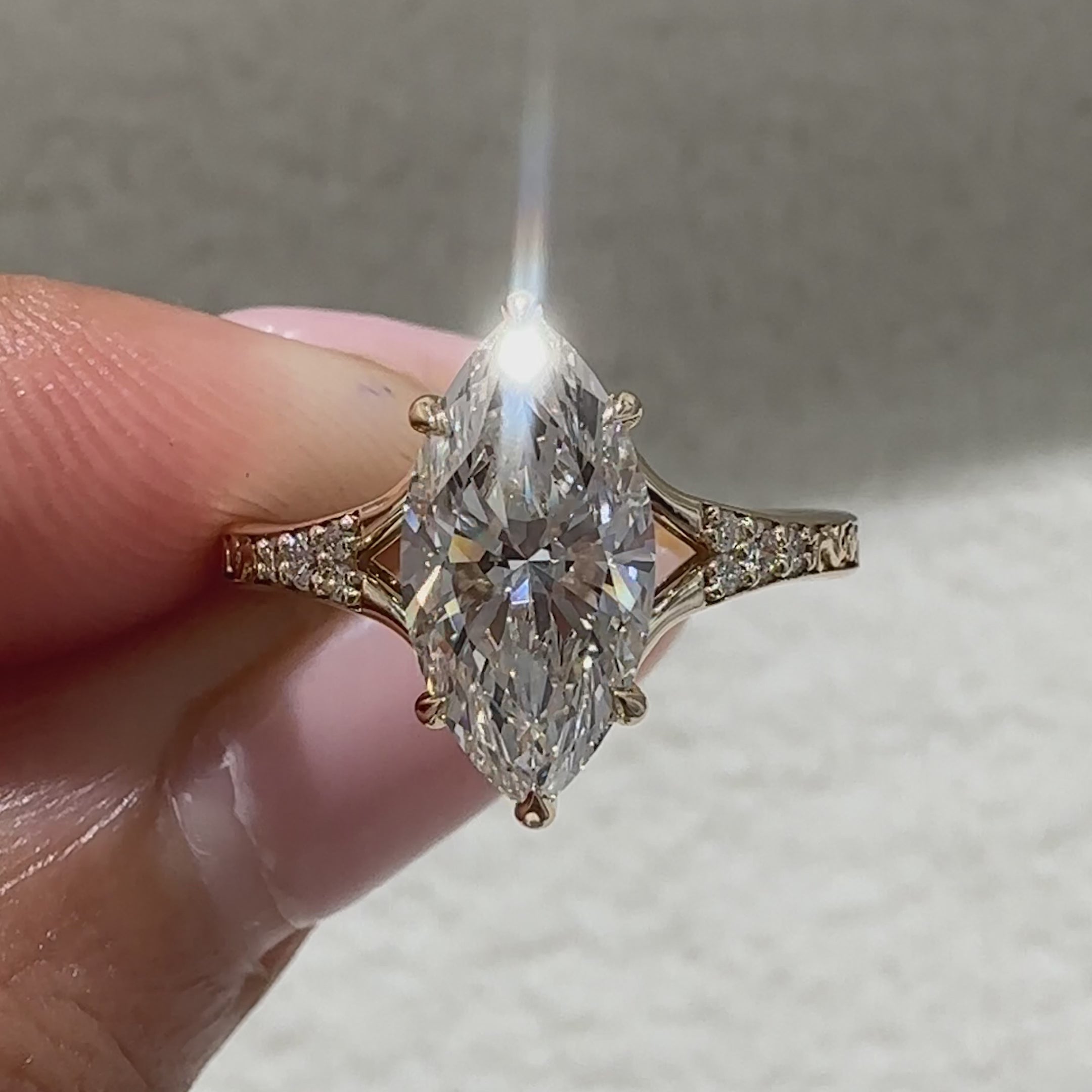 Avideri marquise diamond ring with round side accents
