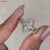 Marquise cut engagement ring in pave setting ring.