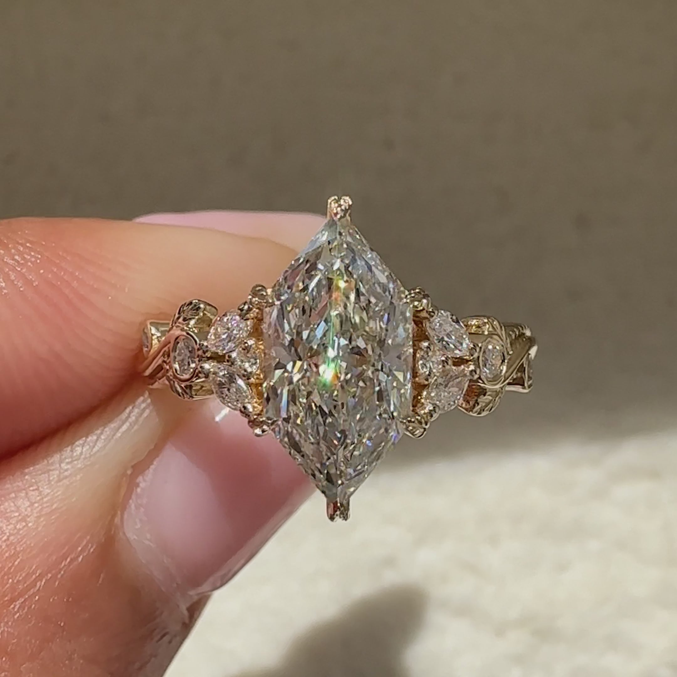 Nature inspired marquise ring with leaf prongs.
