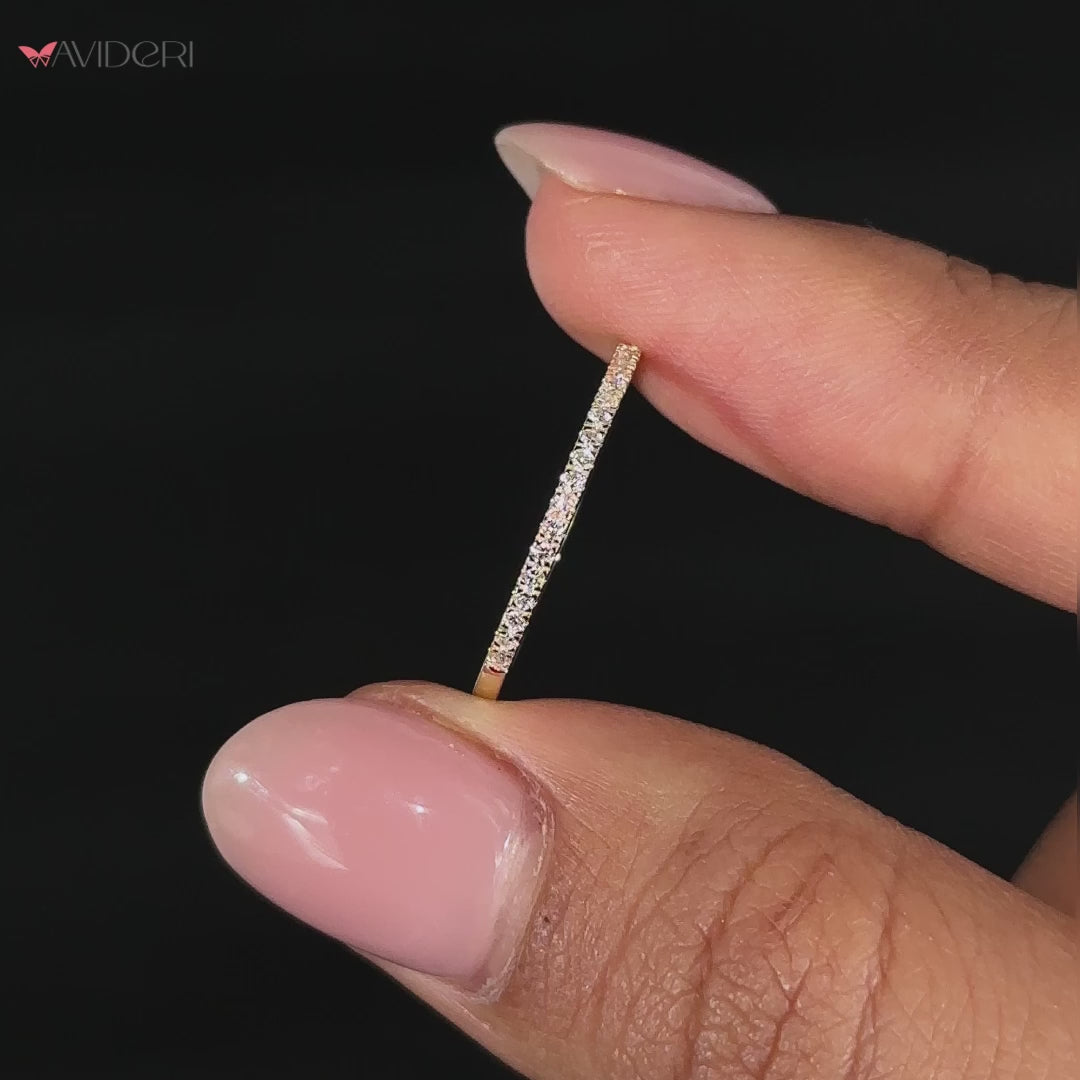 A sleek and modern thin gold wedding band with IGI certified lab-grown diamonds.
