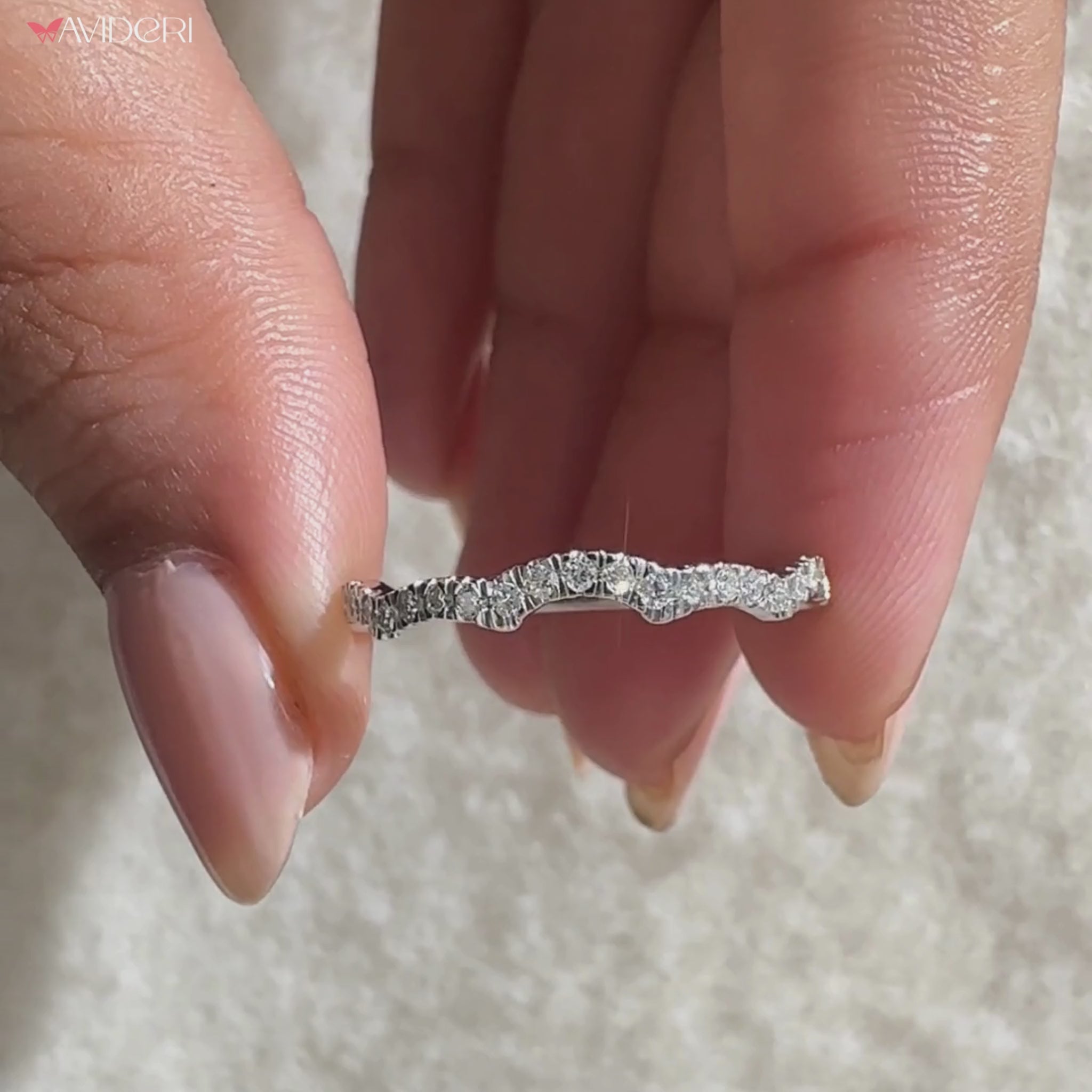 Half eternity band featuring elegant round diamonds.