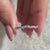 Half eternity band featuring elegant round diamonds.