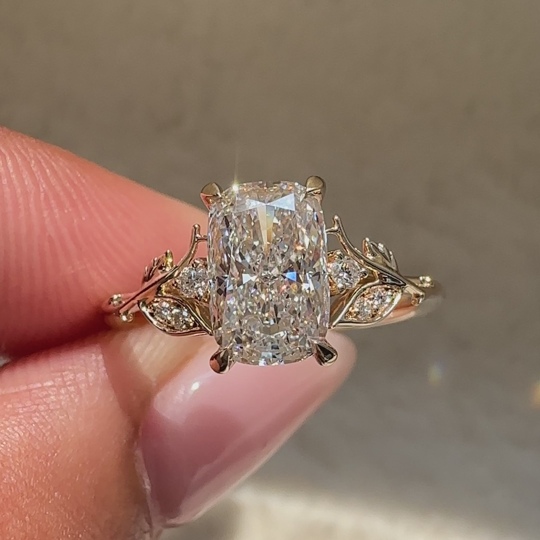 Avideri cushion diamond ring with botanical detailing.
