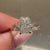 Avideri cushion diamond ring with botanical detailing.
