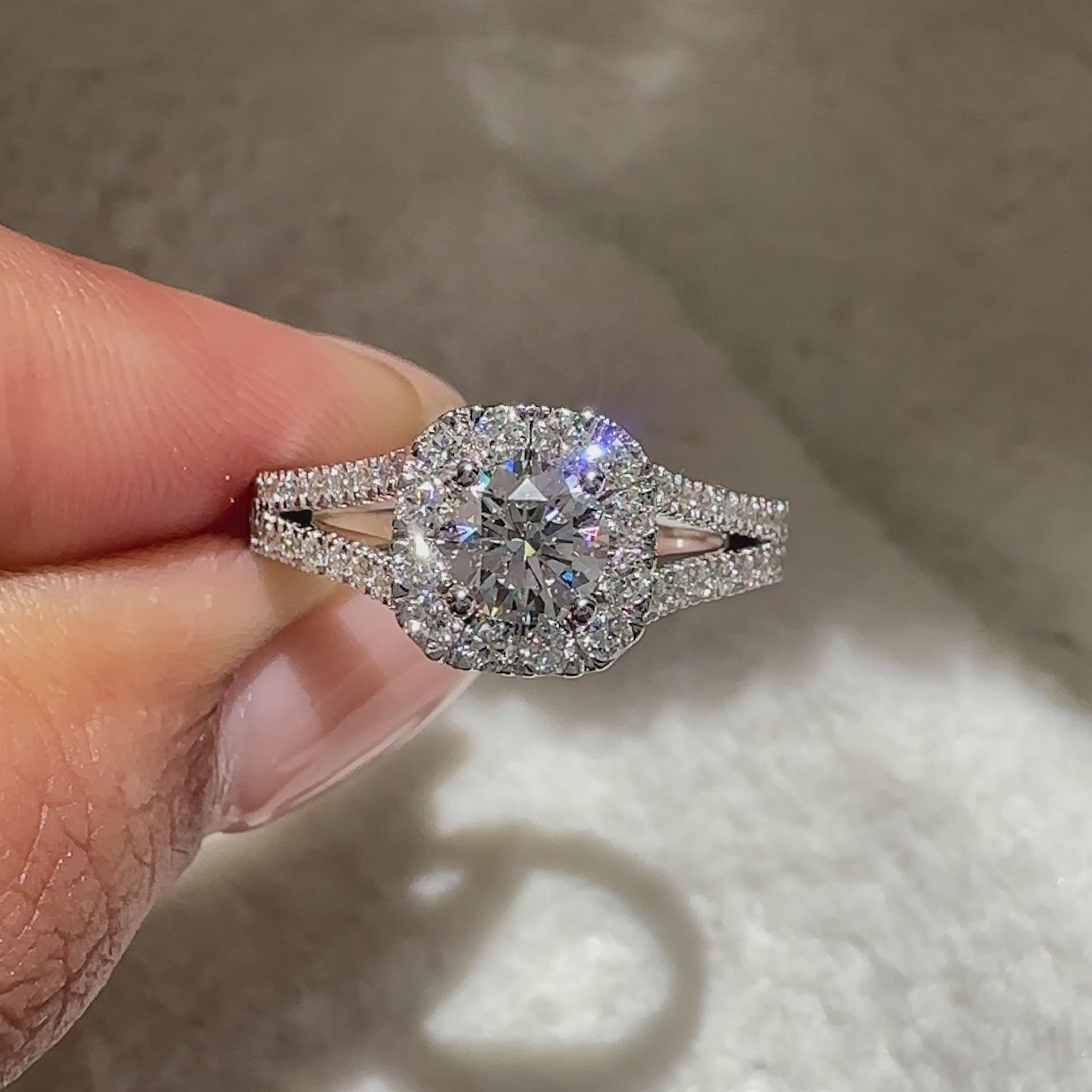 Round diamond ring with halo and pave style.
