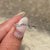 Refined baguette diamond band with clean lines.
