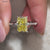 The radiant look of the canary yellow moissanite ring completes the style.