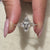 Six claw prong diamond ring for secure setting.
