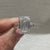 Emerald cut lab grown diamond ring with bar setting accents
