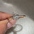Oval cut ring with cathedral setting style.
