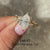 Nature inspired moissanite engagement ring in yellow gold.