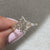 Side stone ring with hexagon diamond and cathedral setting
