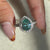 Avideri engagement ring featuring a pear cut diamond with a bezel setting.