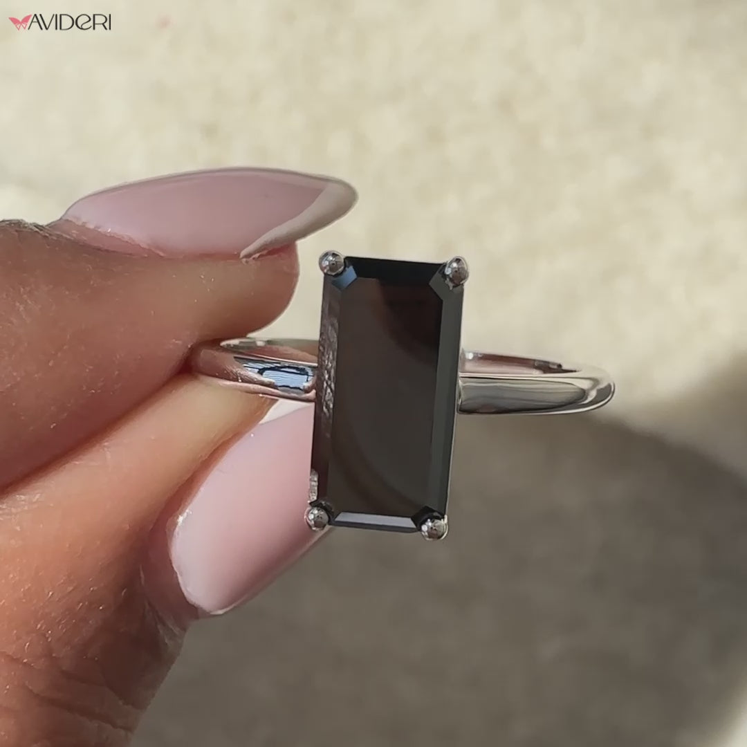 Avideri engagement ring showcasing a unique emerald portrait cut gem.