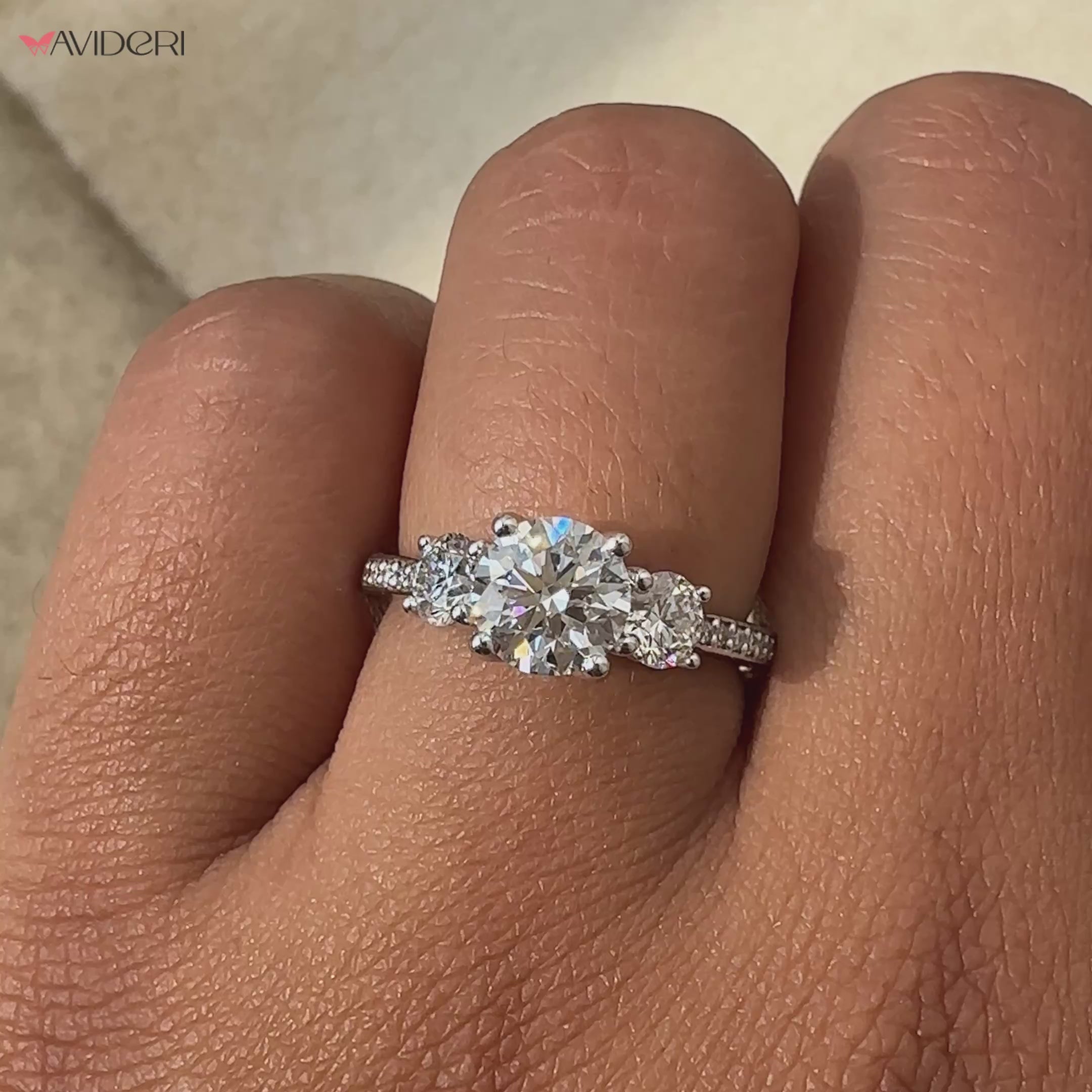Round brilliant cut diamond ring with trellis ring setting.
