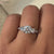 Round brilliant cut diamond ring with trellis ring setting.
