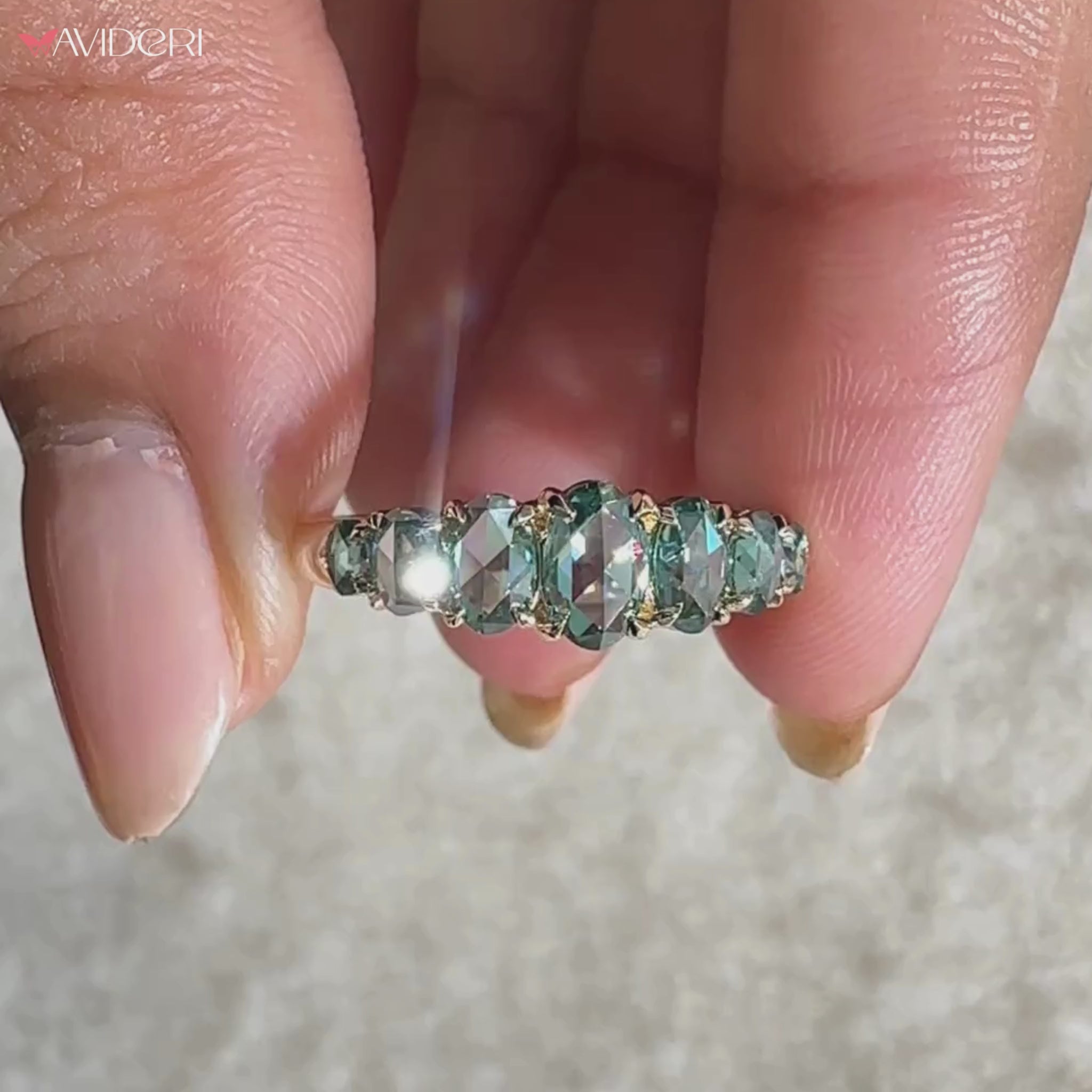 Cyan blue stone band with moissanite wedding band.
