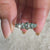 Cyan blue stone band with moissanite wedding band.
