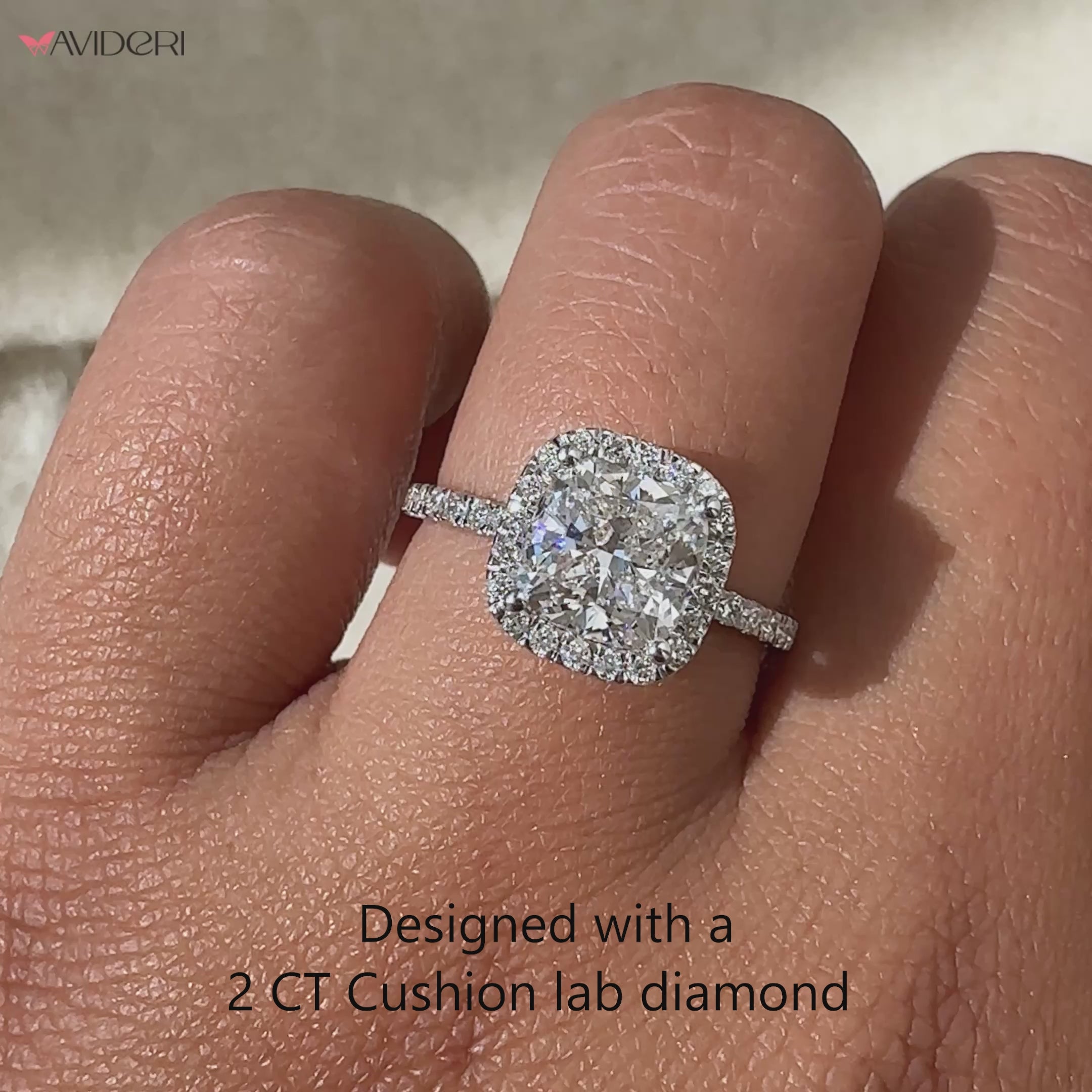 Classic cushion diamond ring with halo design.
