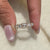 Moissanite stones add sparkle to every part of the band.