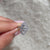 Round cut halo pave setting in a handmade ring.