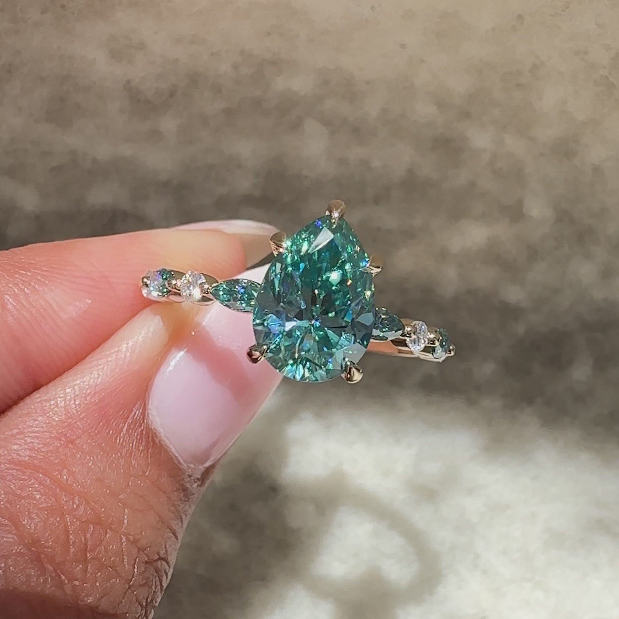 Moissanite ring with round side stones style.
