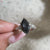 7 stone engagement ring with black moissanite ring.