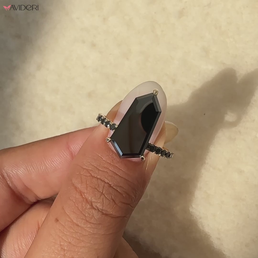 Elegant shield cut ring featuring a modern geometric design.
