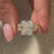 Radiant cut moissanite ring crafted as handmade jewelry.