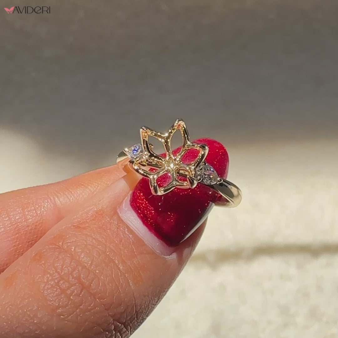 Avideri engagement ring with pear side stones and yellow gold shank.
