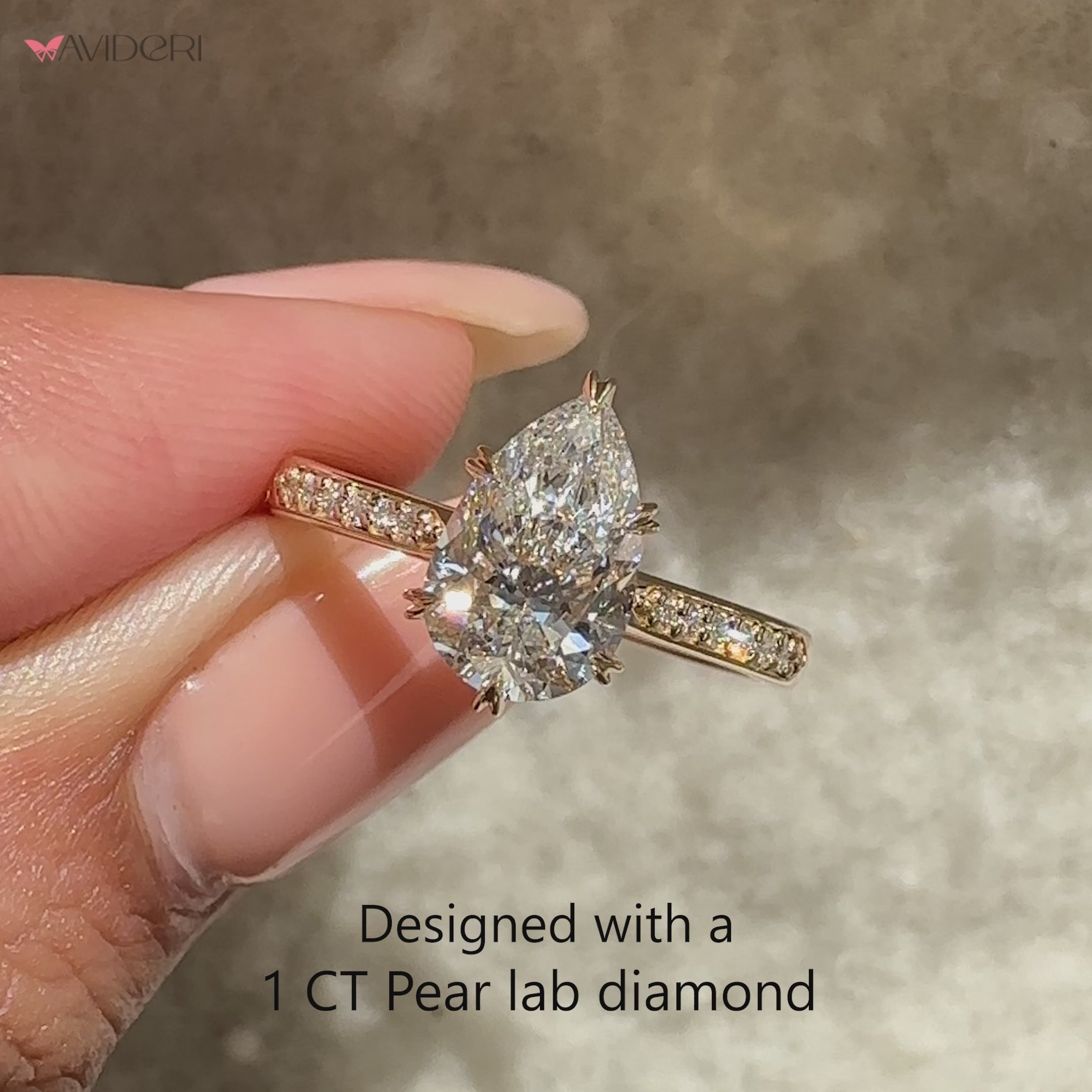 Pear diamond ring with sparkling pave band.
