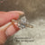 Pear diamond ring with sparkling pave band.

