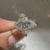 Avideri marquise diamond ring with tapered shank and accents.
