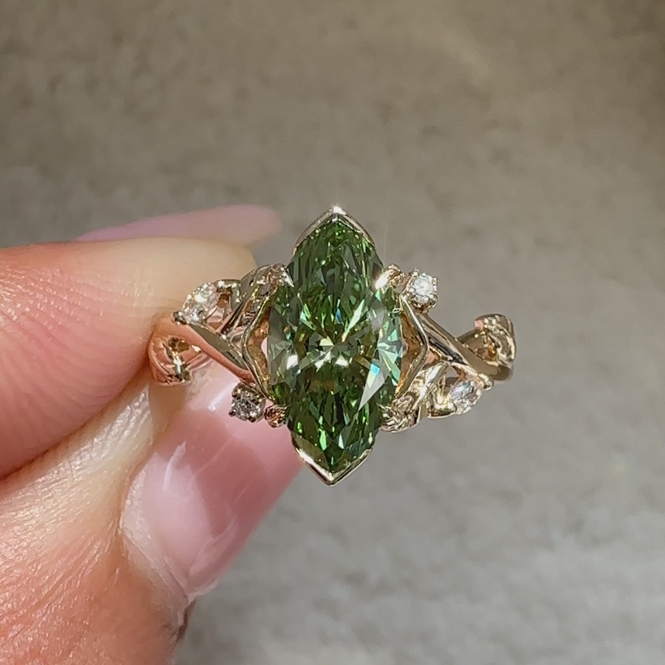 IGI certified green marquise engagement ring.
