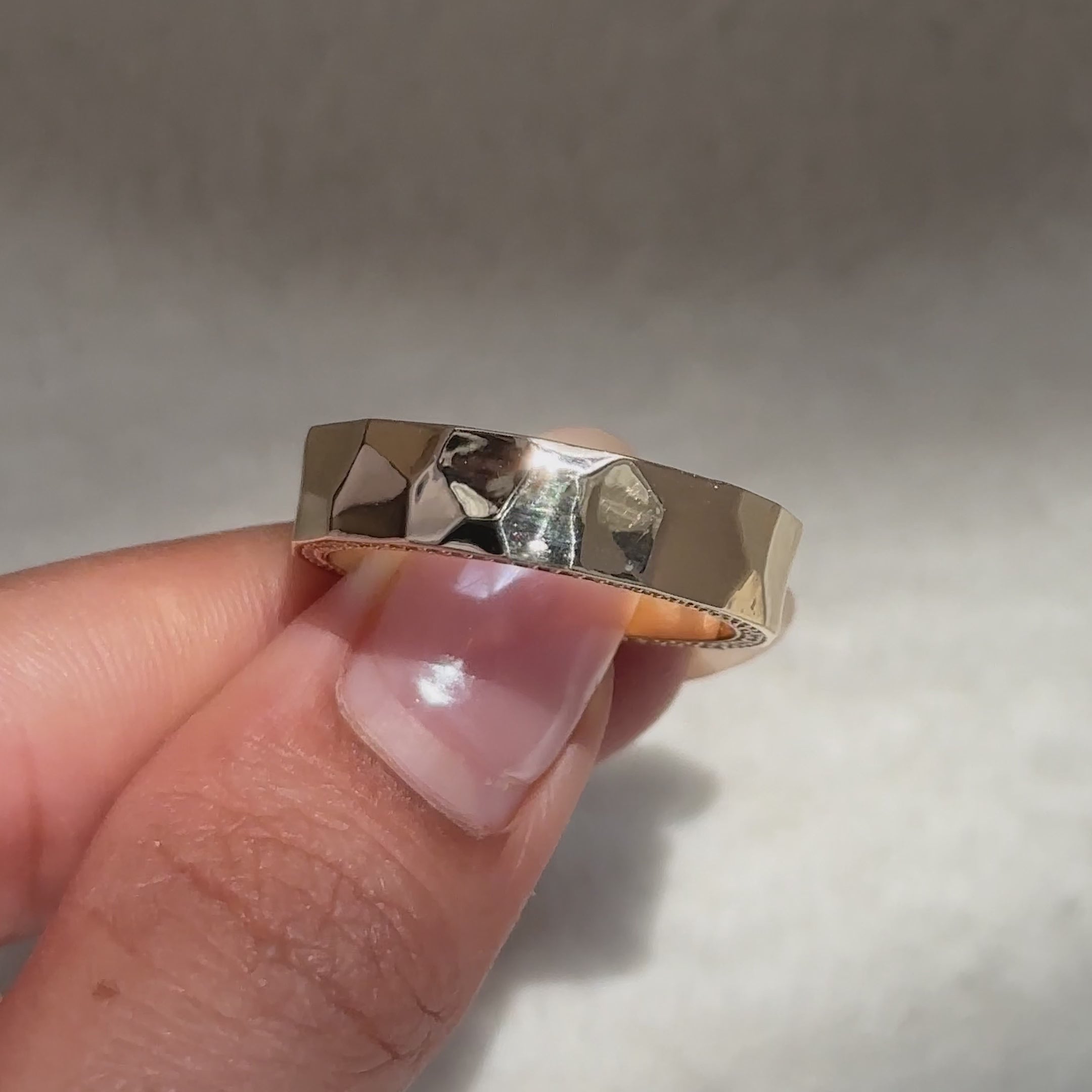 Round diamond wedding band with hammered texture and sparkle.
