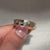 Round diamond wedding band with hammered texture and sparkle.

