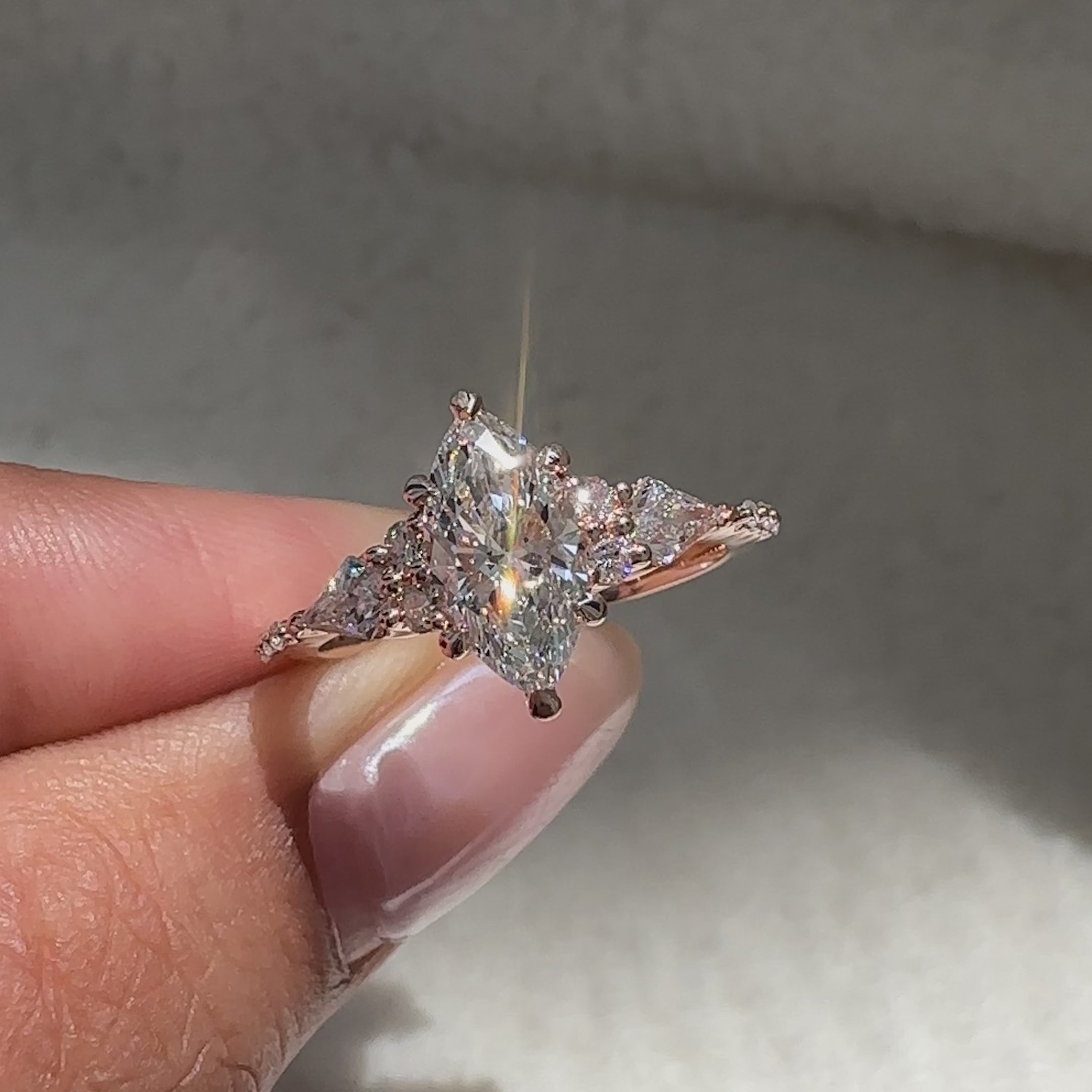 Marquise cut ring with side stone design style.
