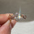 Lab grown oval diamond ring with artistic leaf style prongs.
