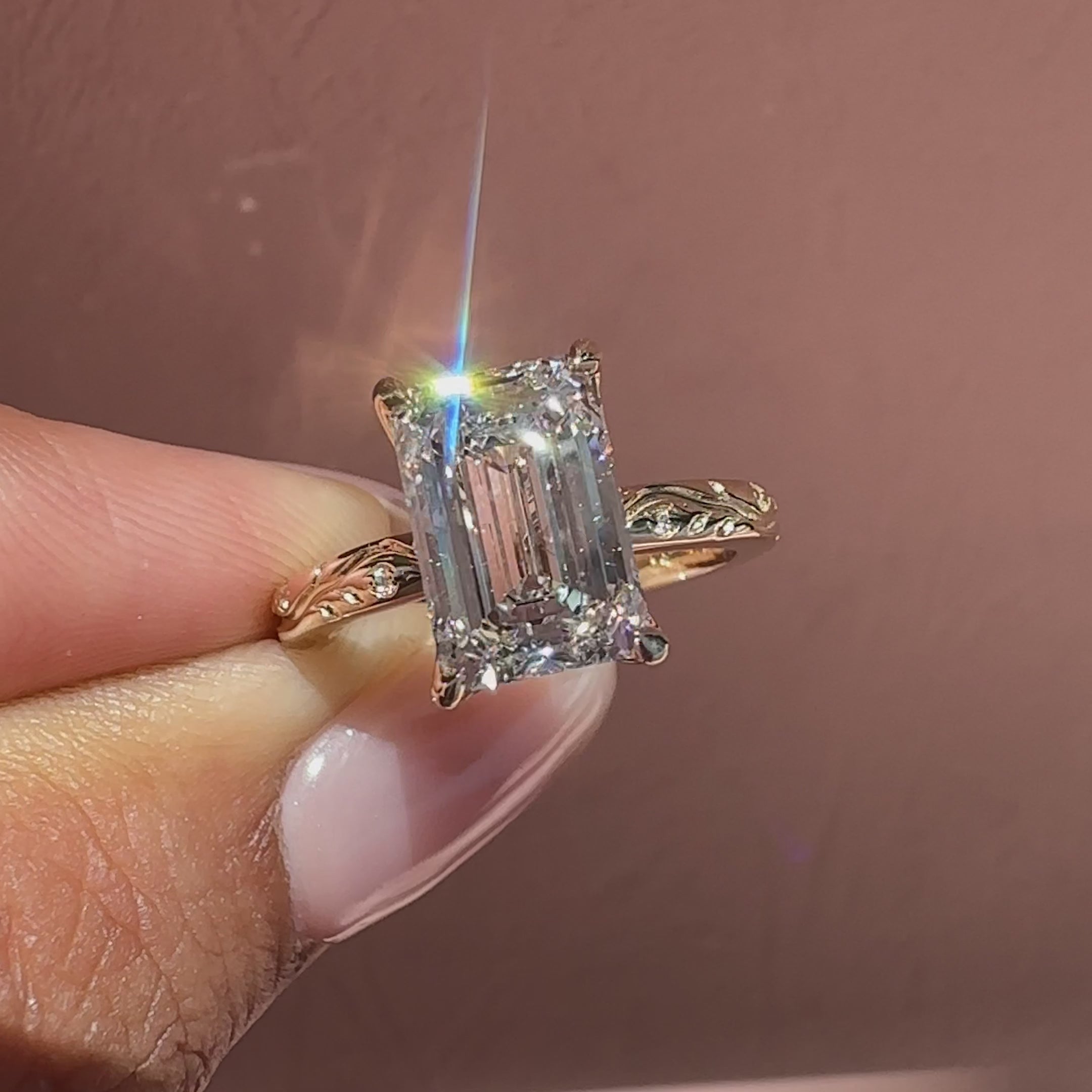 Nature inspired emerald diamond ring design.
